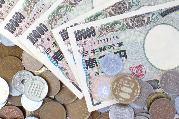 Close - up Japanese yen banknotes and Japanese yen coin stock photo