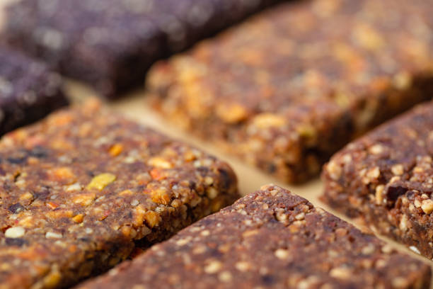 Close up macro of various healthy granola bars (muesli or cereal bar) creative stock image stock photo