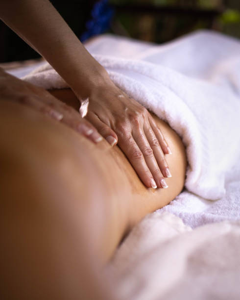 Close up of a back massage at the spa. stock photo