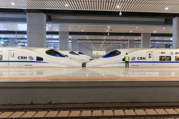 Close up of a Chinese fast train inside the newly opened high speed train station in Kunming. The new fast train station links Kunming to Beijing, Shanghai and Guangzhou stock photo