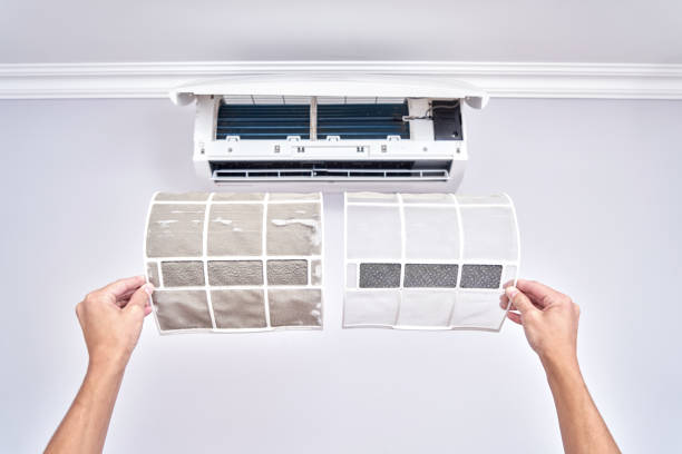 Close up of a clean and dirty filter. Home air conditioner replacement and cleaning concept stock photo