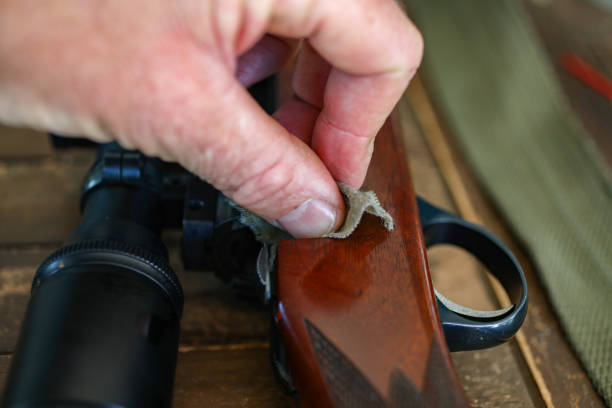 A close up of a hunting rifle being cleaned. stock photo