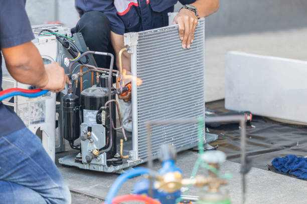 Close up of Air Conditioning Repair team use fuel gases and oxygen to weld or cut metals, Oxy-fuel welding and oxy-fuel cutting processes, repairman on the floor fixing air conditioning system stock photo