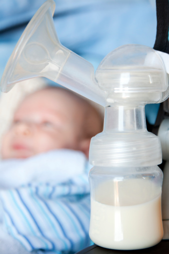 Close Up Of Breast Milk Pump With Defocussed Baby Stock ...
