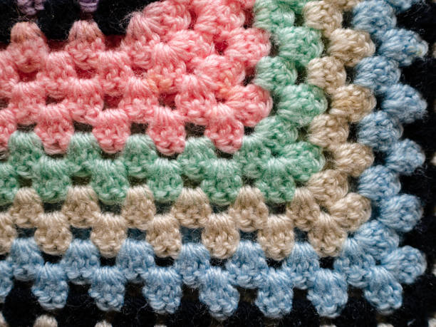 Close up of bright crochet fabric blanket stock photo