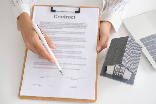 Close up of business person hand putting signing contract,running own small business,have a contract in place to protect it,signing of modest agreements form In office stock photo