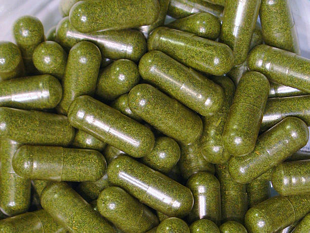 Close up of cannabis capsules in glass dish stock photo