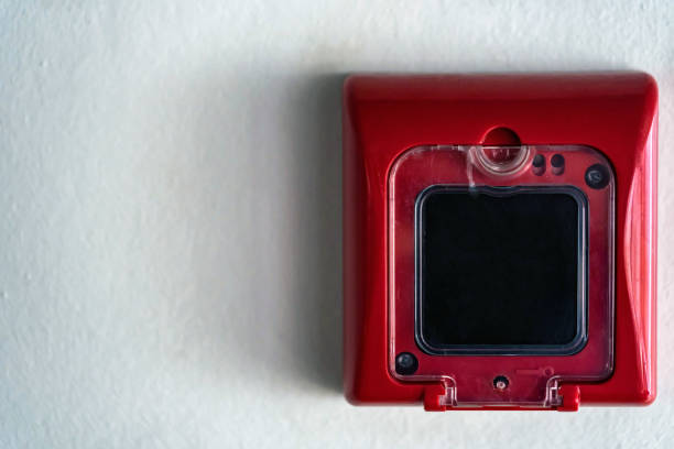 Close up of fire alarm switch in red box on wall stock photo