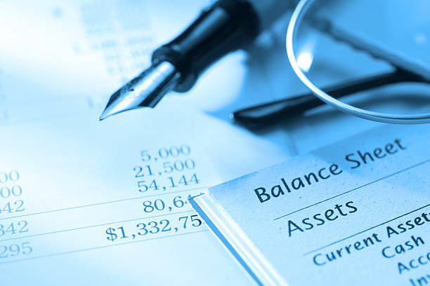 Close up of fountain pen on a balance sheet A balance sheet. bank statement stock pictures, royalty-free photos & images