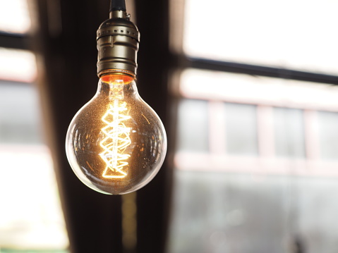 Close up of glowing modern light bulb