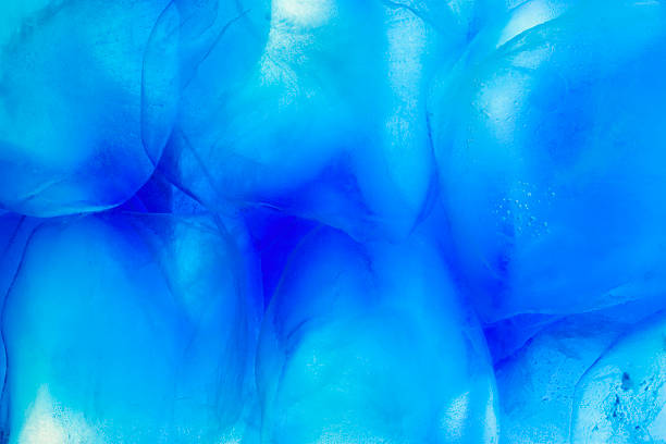 Close up of ice cubes in blue water stock photo