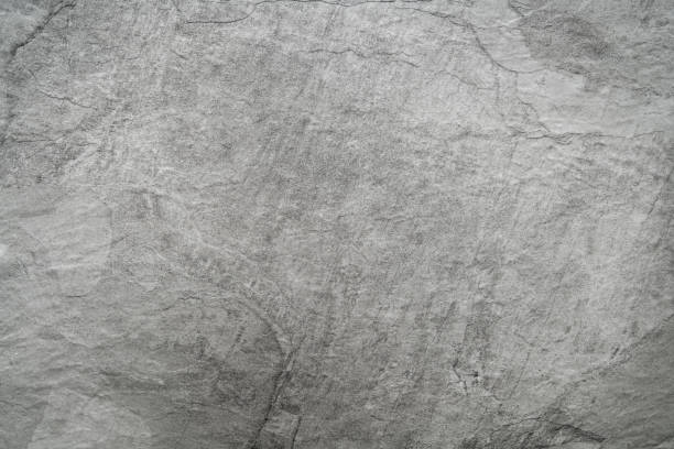 Close up of light grey black slate stone background or texture Close up of light grey black slate stone background or texture chalk rock stock pictures, royalty-free photos & images