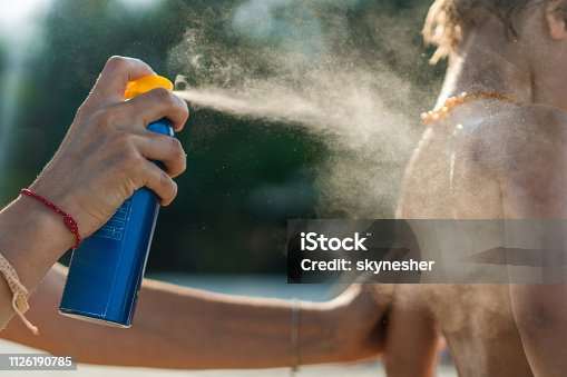 istock Close up of mother protecting her son with suntan lotion at the beach. 1126190785