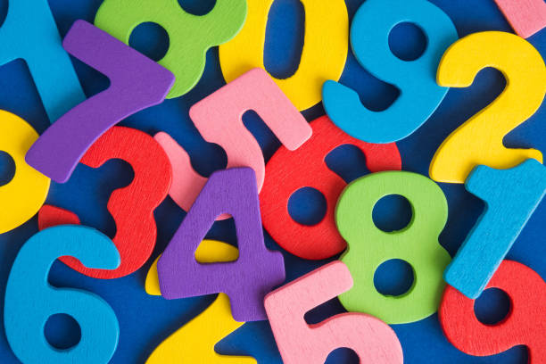 Close up of multicolored wooden numbers back to school abstract. stock photo