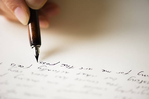 Close up of pen writing a letter stock photo
