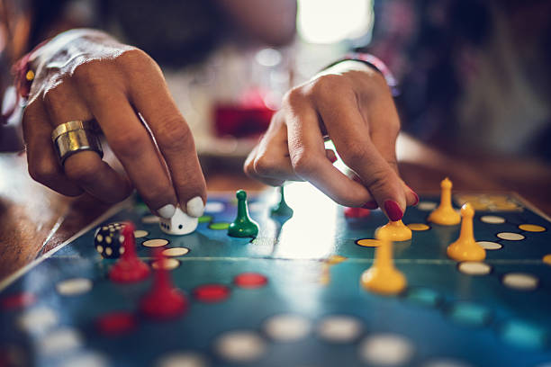 Close up of people playing cross and circle game. stock photo