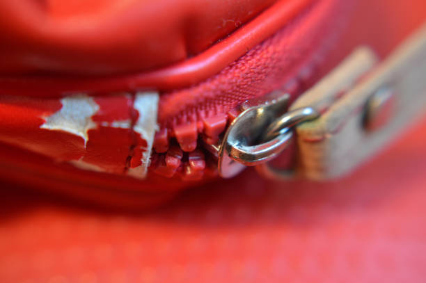 Close up of red broken bag zipper  broken suitcase stock pictures, royalty-free photos & images