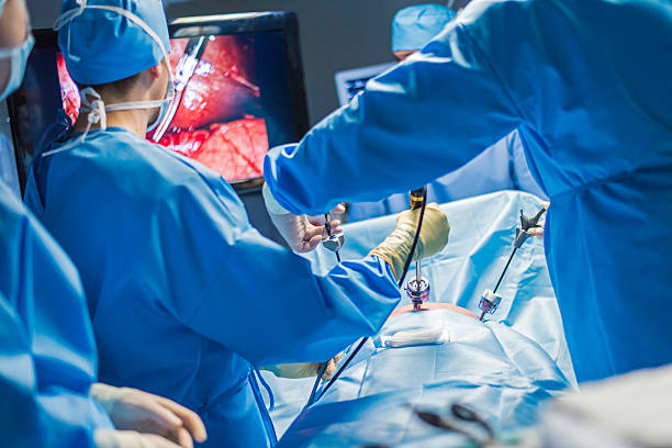 Close up of surgeon operating a patient stock photo