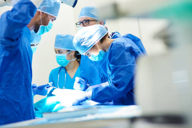 close up of surgery team operating - operation sjukhus bildbanksfoton och bilder