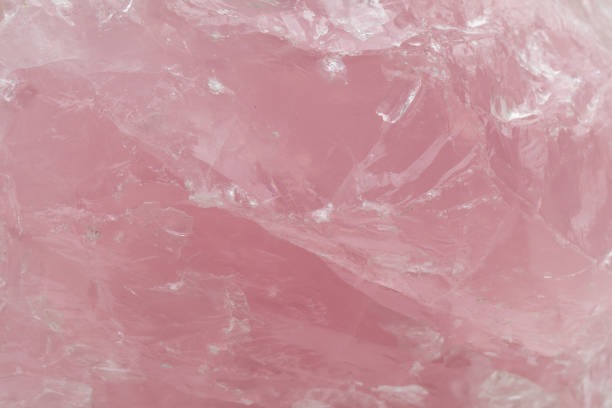 Close up of the surface of Rose Quartz Macro of pink rose quartz, which is used as a healing stone for universal love rose quartz stock pictures, royalty-free photos & images