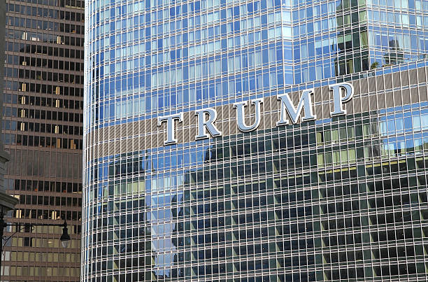 Close up of the Trump Tower sign Chicago, IL, USA - August 17, 2015: Close up of the Trump International Hotel & Trump Tower sign, named after billionaire Donald Trump.  donald trump stock pictures, royalty-free photos & images