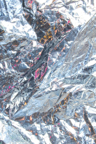 Close Up of Tin Metal Foil Holographic Abstract Background stock photo