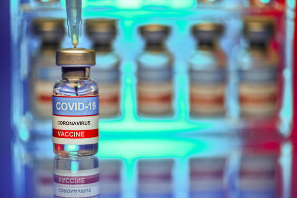 Close up of vials and syringe - Covid-19 vaccine research stock photo