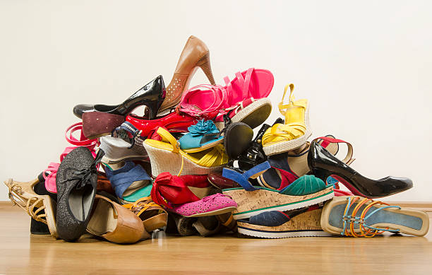 Close up on big pile of colorful woman shoes. stock photo