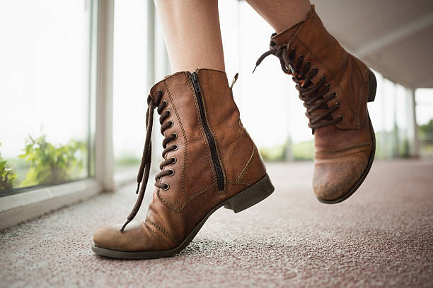 [Image: close-up-on-woman-shoes-in-front-of-wind...BoKsPmCek=]