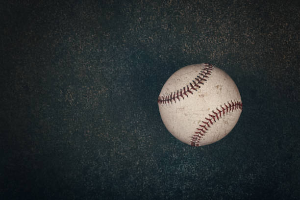 Close up one baseball ball on dark background stock photo