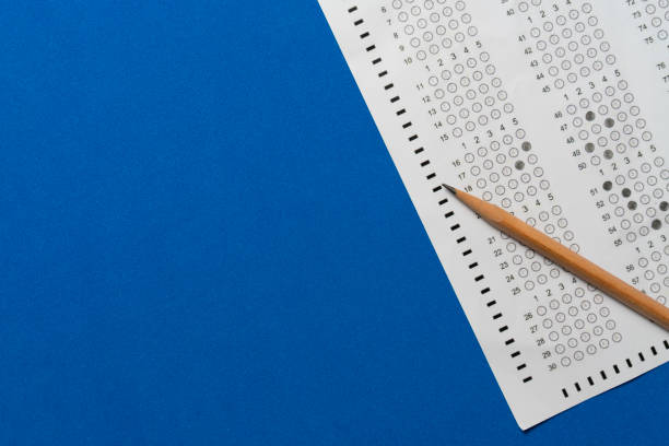 close up pencil on answer sheets, education concept stock photo