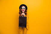 Close up photo beautiful she her lady very glad black friday laughter carry packs perfect look buy buyer birthday sale discount wear specs formal-wear costume suit isolated yellow bright background.