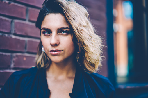 Close Up Portrait Of Serious Young Hipster Girl With Short Haircut