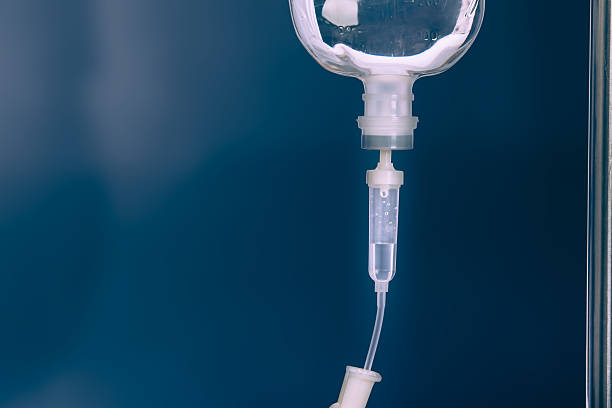 Close up saline IV drip for patient in hospital stock photo