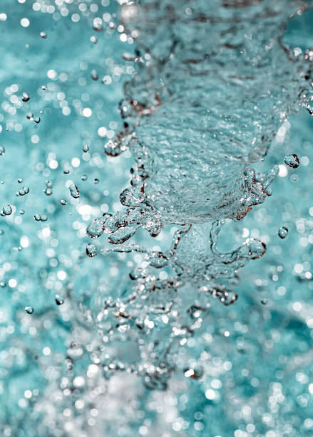 Close up texture of flowing running water, water in motion abstract and textural stock photo
