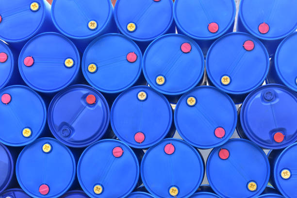 Close up top view of big blue plastic tank or empty gallon stacked, big drum use for gasoline, chemical, fuel. stock photo