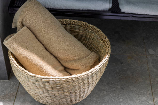 Close up view of basket with clean towels at hotel room. Greece. stock photo