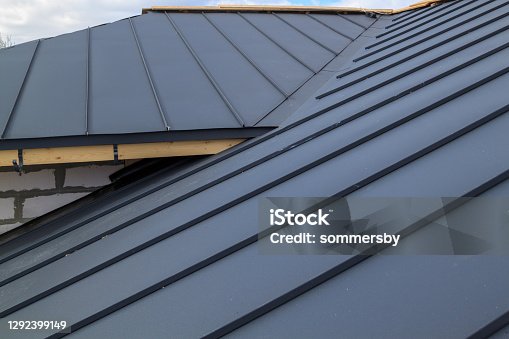 istock close up view of  house under construction with grey folding roof on waterproofing layer 1292399149