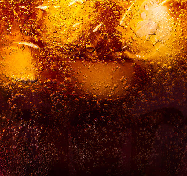 Close up view of the ice cubes in cola background stock photo