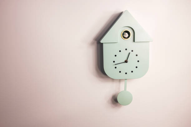 Close up view of wall cuckoo clock on colorful background. Sweden. stock photo