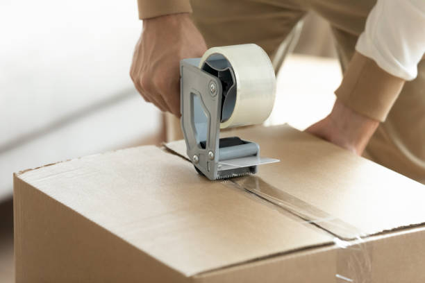 48 Man Closing Carton Box With Adhesive Tape Stock Photos, Pictures & Royalty-Free Images - iStock