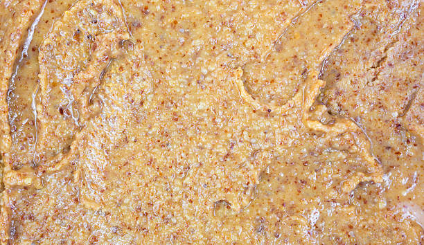 Close view almond butter A very close view of almond butter. almond butter stock pictures, royalty-free photos & images