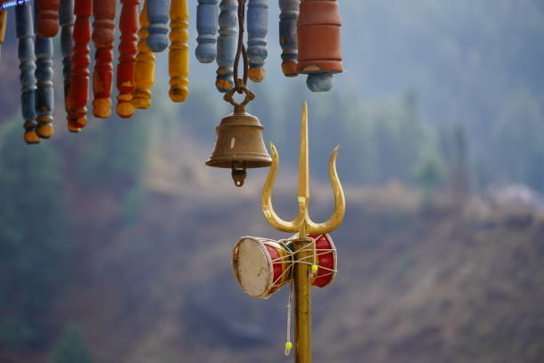 Close view of shiva's trishul and damroo hindu god shiva symbol Close view of shiva's trishul and damroo hindu god shiva symbol kedarnath temple stock pictures, royalty-free photos & images