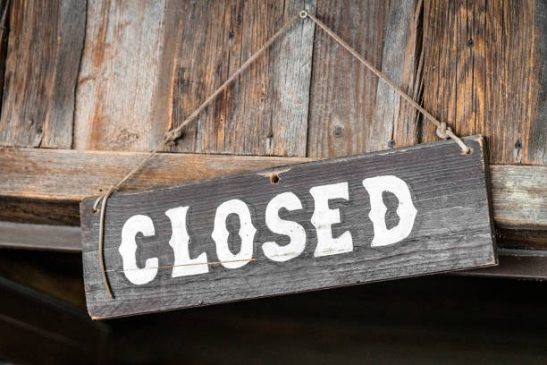 Closed for business sign made of wood stock photo