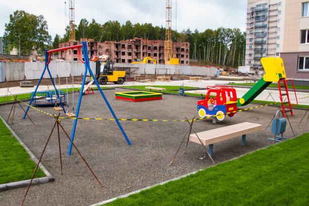 closed kids play ground near apartments building construction site stock photo