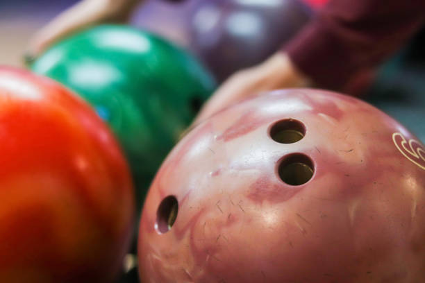Close-up a group of colored bowling balls in the club stock photo