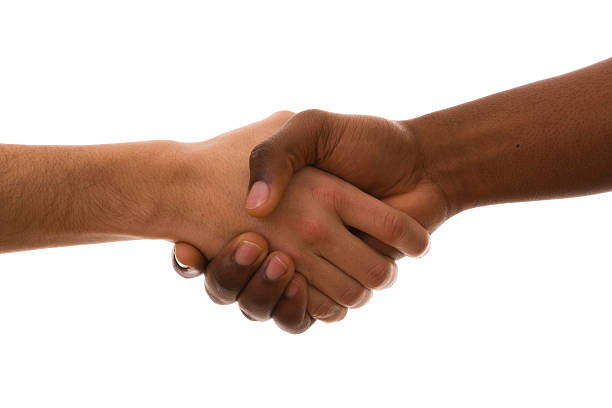 Close-up a handshake against a white background stock photo