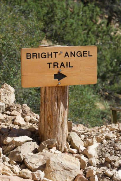 Close-up, Bright Angel Trail Sign, Grand Canyon National Park Close-up of a directional sign along the upper section of the Bright Angel Trail near the South Rim of the Grand Canyon on a hot, summer day. south rim stock pictures, royalty-free photos & images