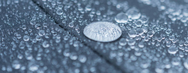 Closeup detailed view of raindrops on a fabric, a background. stock photo