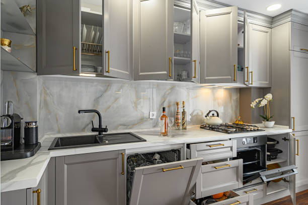 Closeup details of grey and white modern classic kitchen, all doors are open Closeup details of grey and white contemporary classic kitchen designed in modern style, all furniture doors and drawers are open cabinet stock pictures, royalty-free photos & images